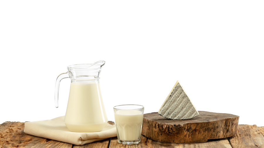 Different milk products, cheese, cream, milk on wooden table and white background. Healthy eating and lifestyle, organic natural nutrition, diet. Delicious food and drinks.