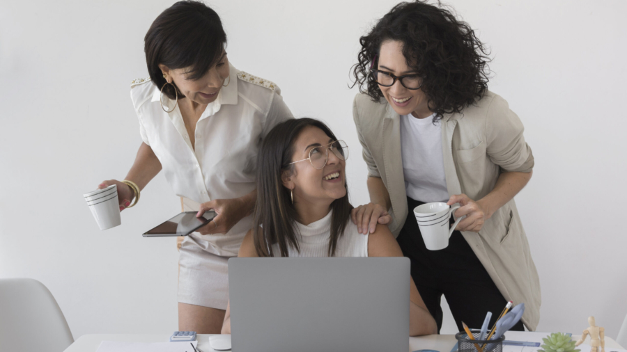 front-view-beautiful-modern-women-working-together